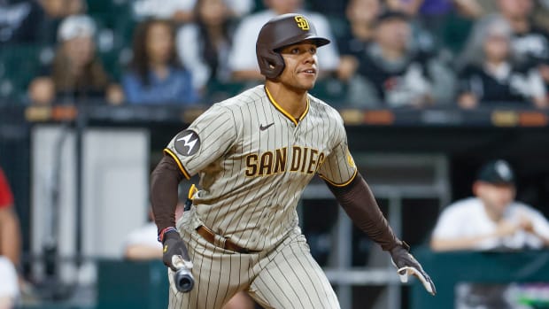 Juan Soto looks up while going to put the bat down